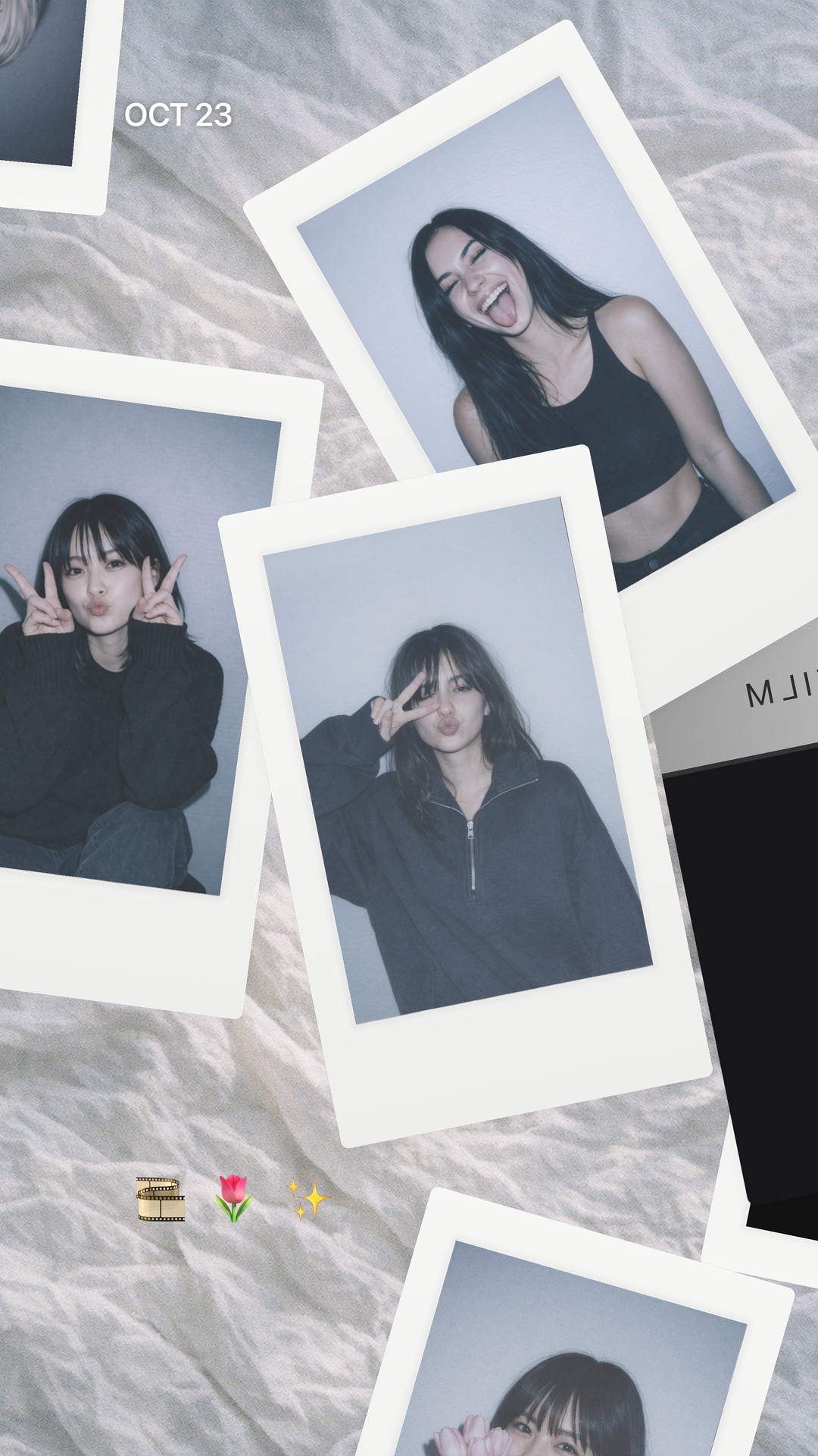 Polaroids on a bedsheet